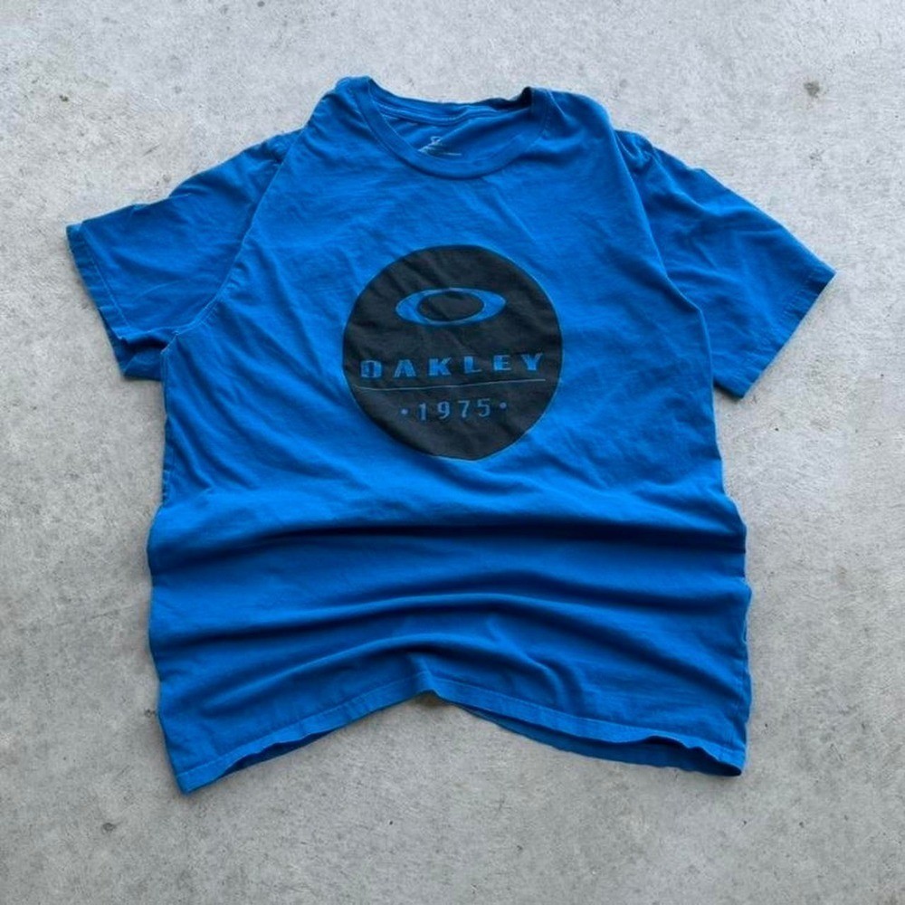 Vintage Oakley 1975 Blue T-shirt Essential