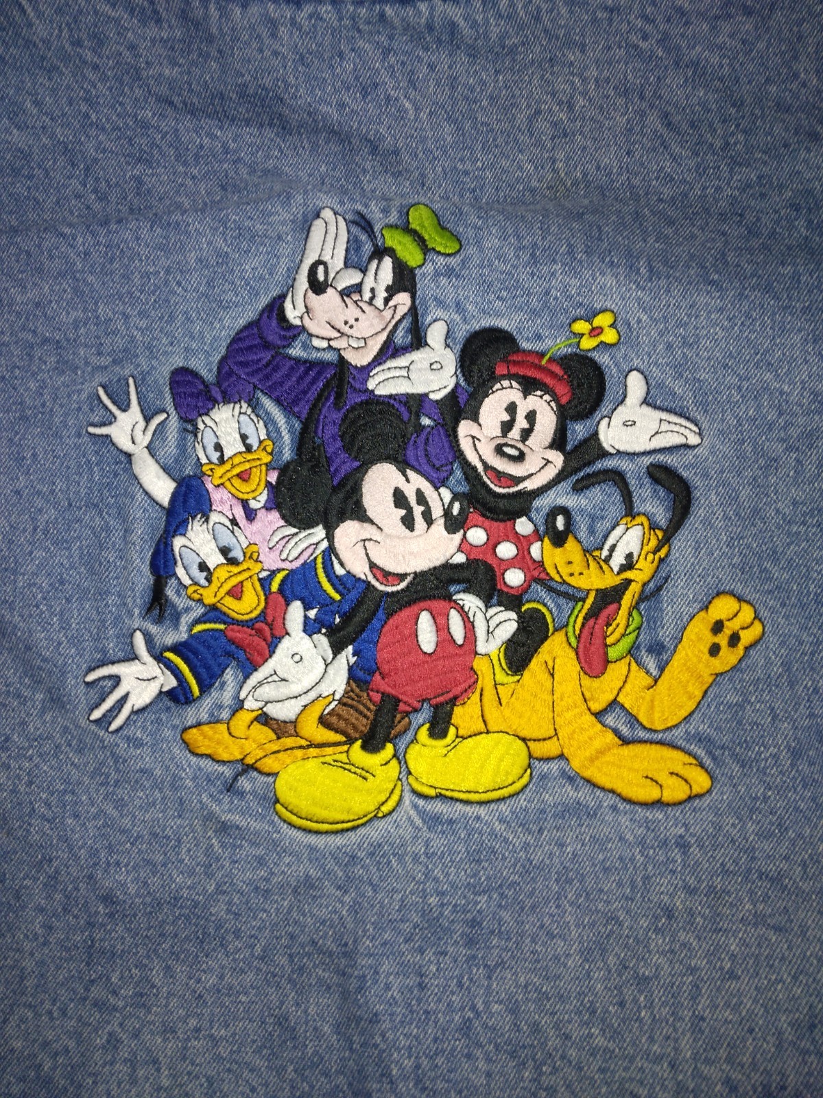 Vintage Disney jean jacket circa 1990’s w/ Disney characters patch, size large.