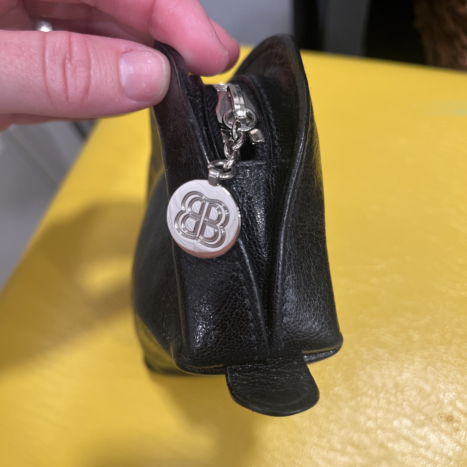 Vintage BALENCIAGA Black Leather Small zipped Bag Rare silver circular emblem.