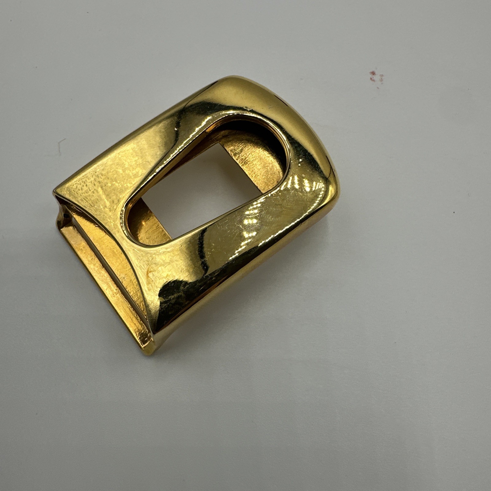 Seven vtg gold toned unisex buckles. Made in Spain and Italy. Stamped. See pics.