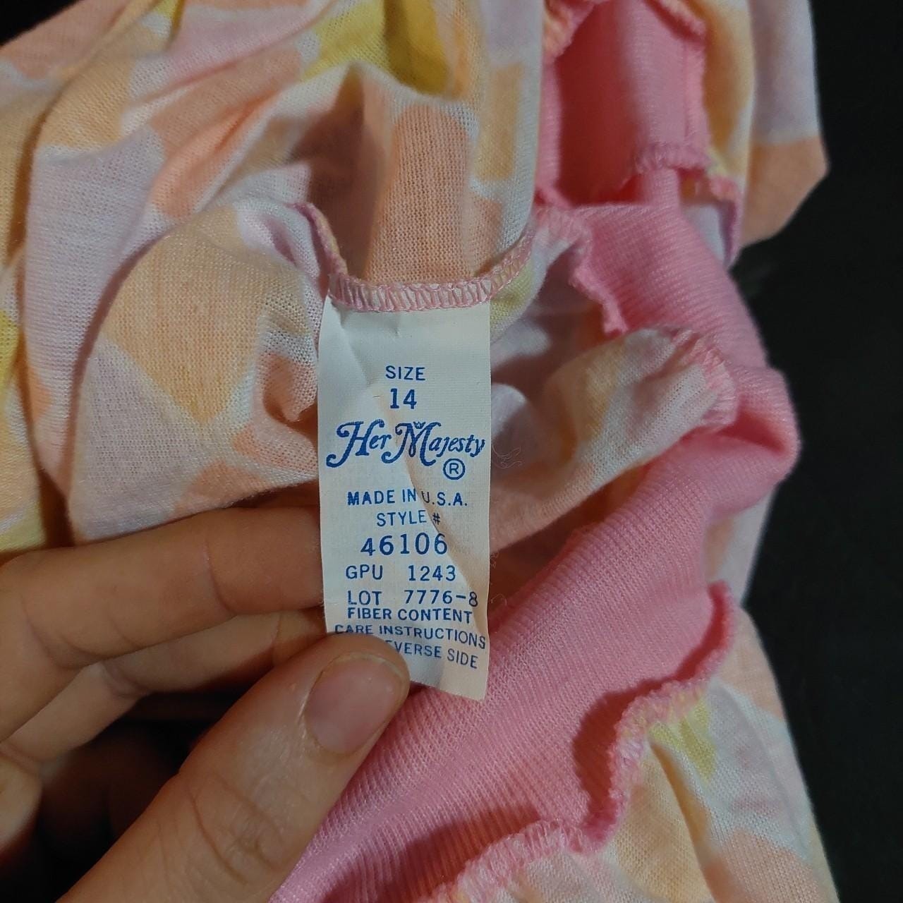 Vintagecpastel pink, purple, yellow, and orange diamond top with a ruffle hem.