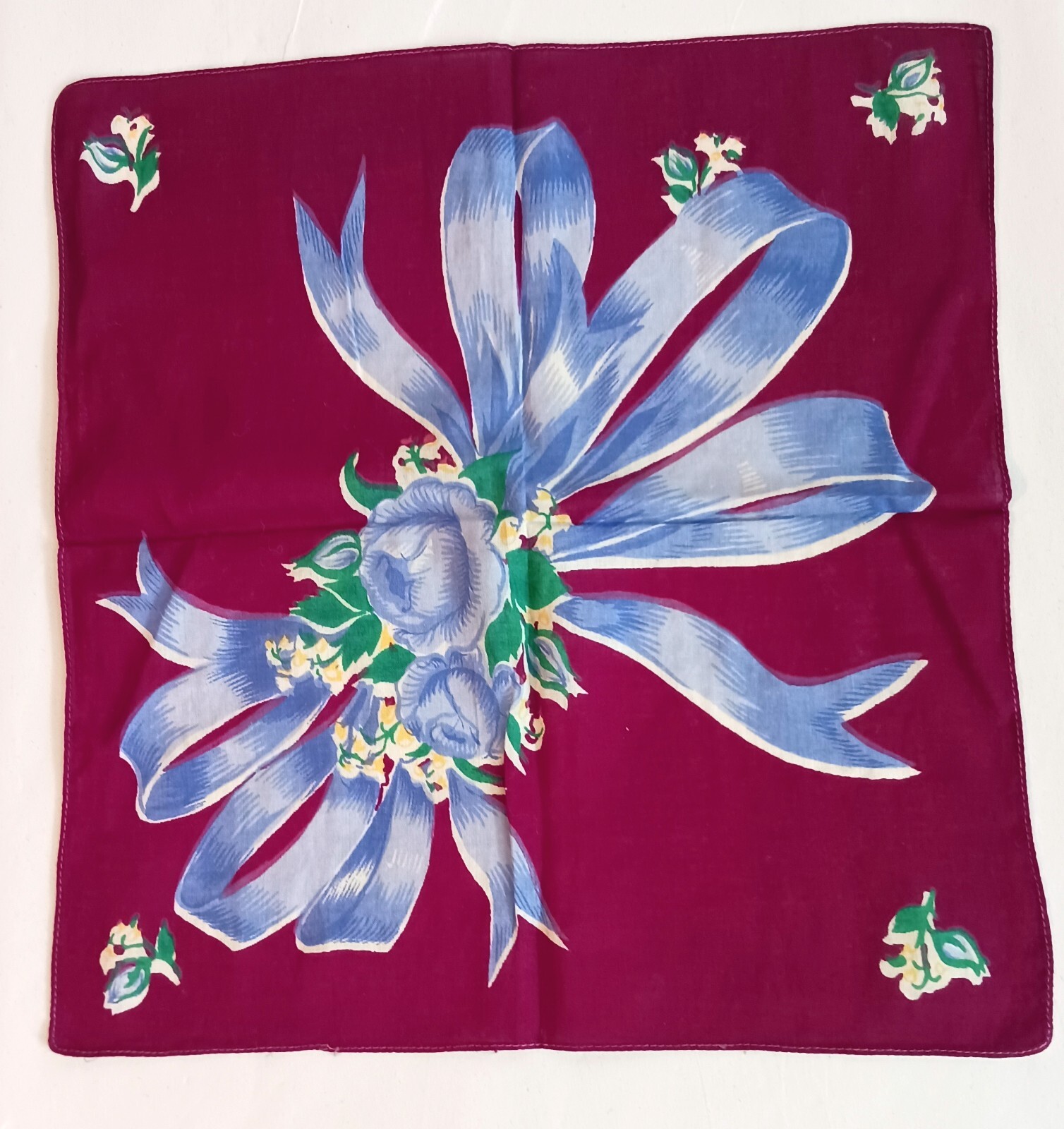 Vintage Handkerchief Blue Flowers and Ribbon on Burgundy Background