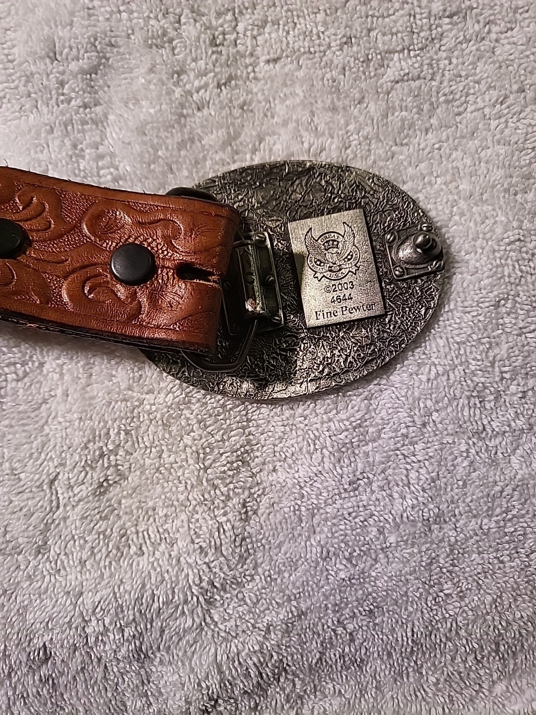 Vintage hand tooled belt 32 to 36 ” With buckle. Overall length is 40 inches.