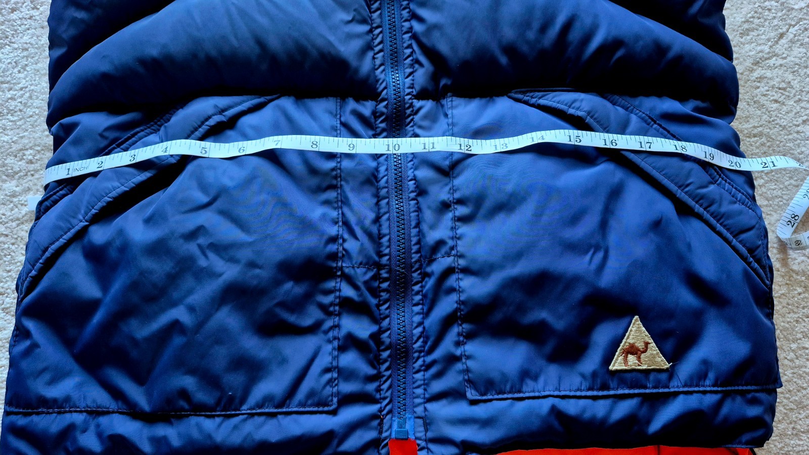 Vintage 1970s-1980s reversible blue and orange puffer vest from the Camel brand