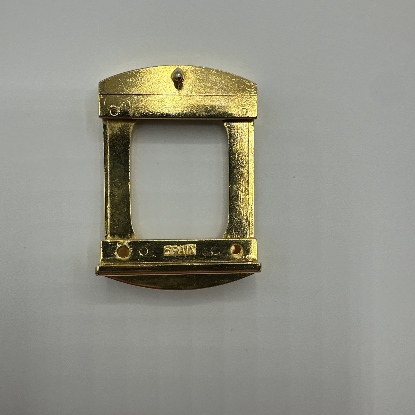 Seven vtg gold toned unisex buckles. Made in Spain and Italy. Stamped. See pics.