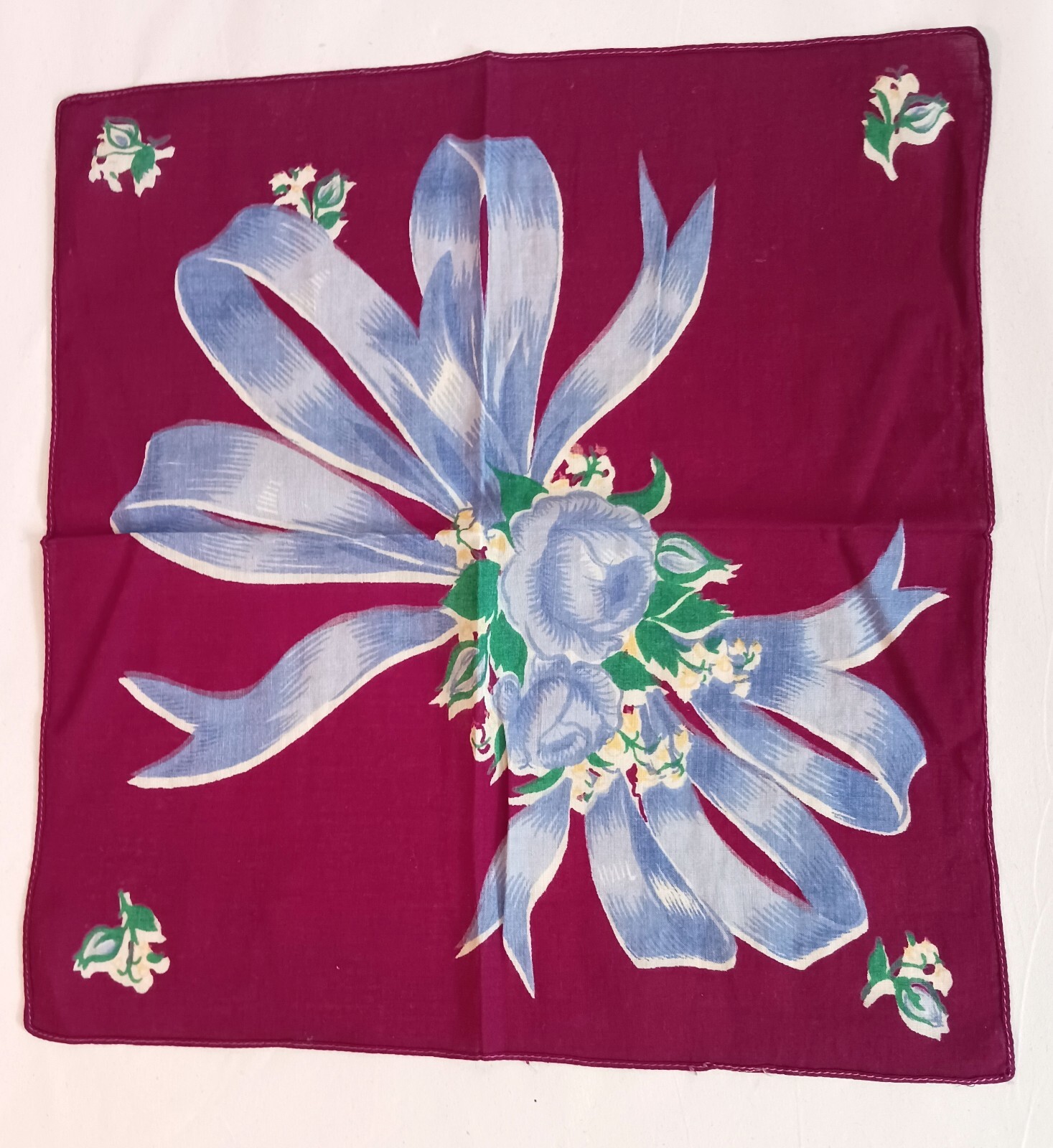 Vintage Handkerchief Blue Flowers and Ribbon on Burgundy Background