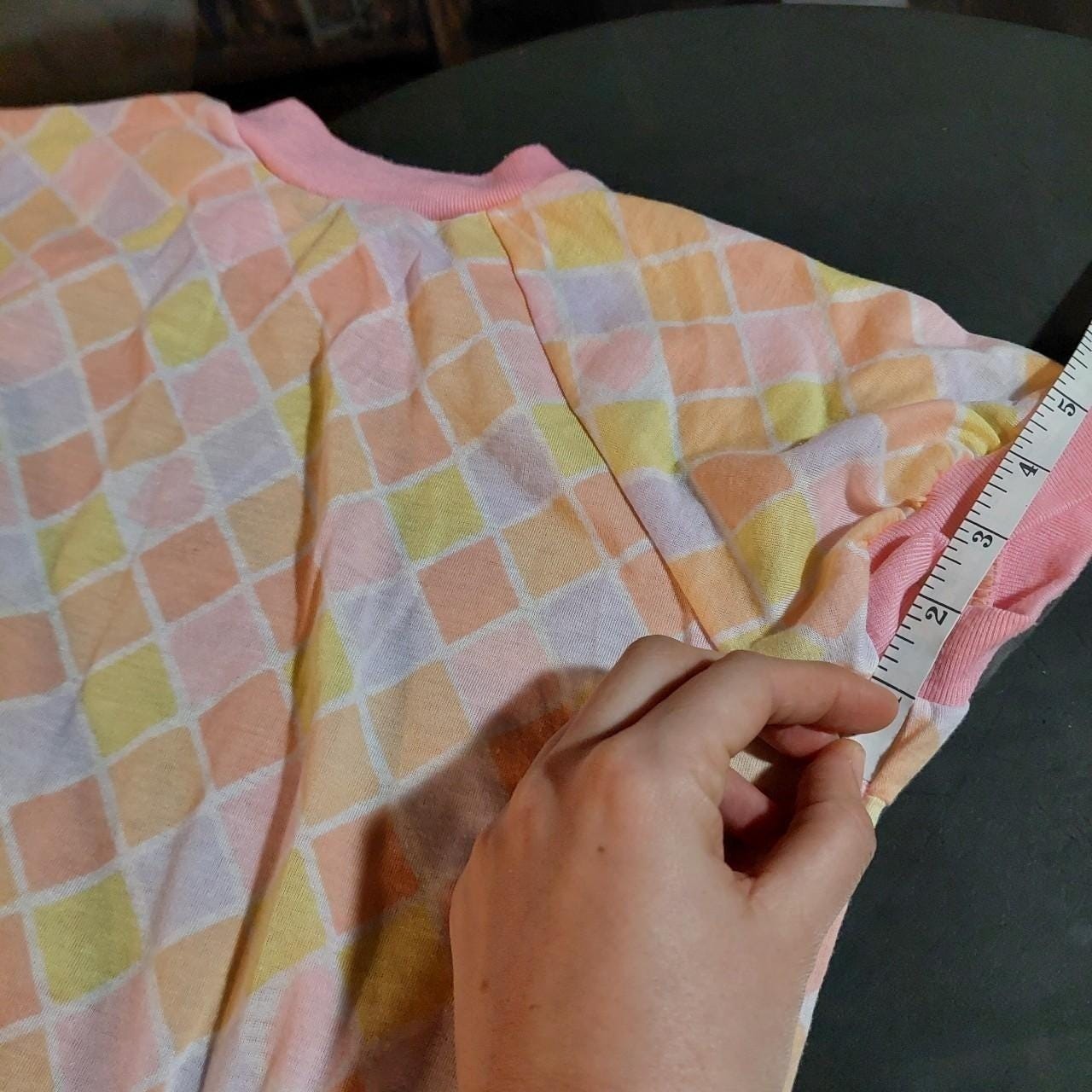 Vintagecpastel pink, purple, yellow, and orange diamond top with a ruffle hem.